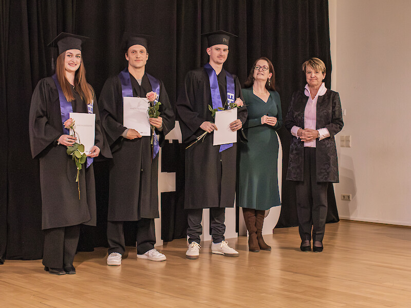 A formal ceremony to present the master’s degrees.