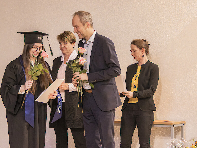 A formal ceremony to present the master’s degrees.